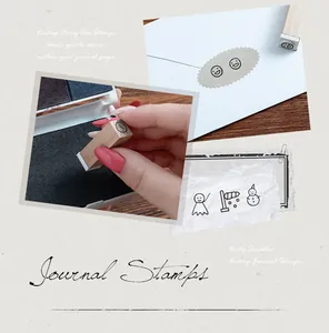 Detailed view of vintage wooden journal stamps featuring weather and emoticon icons for DIY.