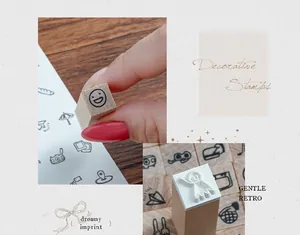 Detailed close-up of decorative wooden stamps with retro smiley and ghost designs