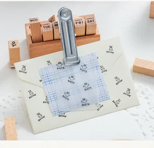 Close-up detail of DIY wooden stamps in beechwood box for creative journal decoration