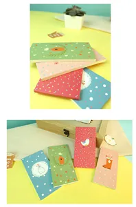 Detailed view of four Mori-style pocket memo pads with cute nature illustrations