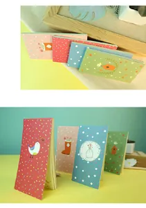 Forest style portable planner notebooks with colorful covers in a detailed scene