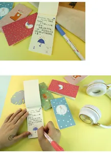 Close-up showing usage of forest style portable sticky note pad for daily journaling