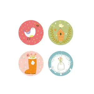 Set of four forest-themed circular memo pads with cute bird and floral illustrations