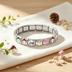 Close-up of stainless steel Italian charm bracelet with colorful mushroom patterns