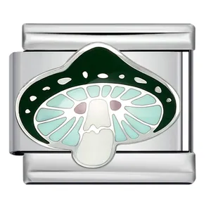 Close-up detail of stainless steel Italian charm link with green mushroom enamel design