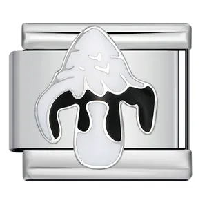 Detail view of a stainless steel Italian charm with black and white mushroom enamel