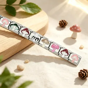 Handcrafted stainless steel Italian charm bracelet featuring colorful mushroom enamel designs