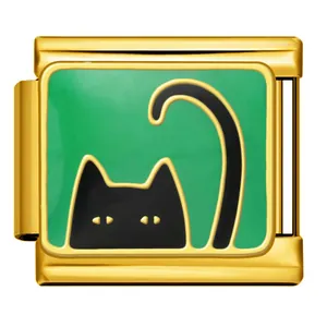 Close-up of a gold Italian charm featuring a cute black cat on a green enamel background