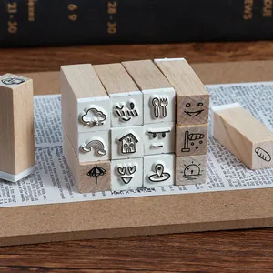 Set of 25 wooden stamps with weather and emoji icons for creative DIY journaling.