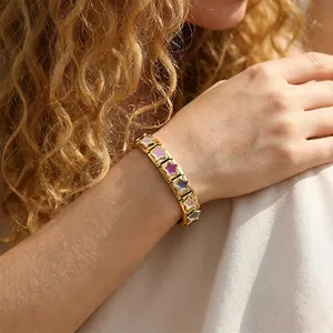 Elegant gold stainless steel Italian charm bracelet featuring colorful leopard star charms