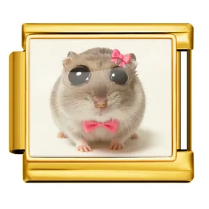 Detailed view of a gold Italian charm link featuring a cute big-eyed hamster with pink bows.