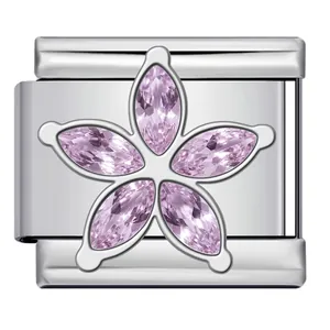 Macro detailed view of Italian charm link featuring a pink crystal five-petal flower design