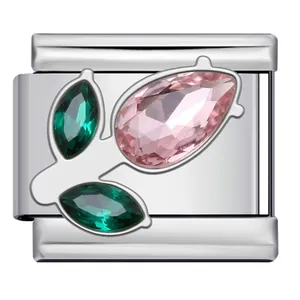 Close-up detail of stainless steel Italian charm with pink and green flower rhinestones.