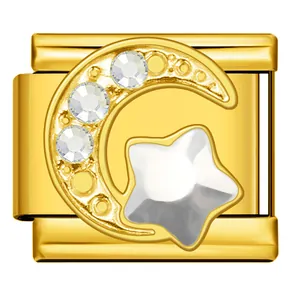 Macro view of gold Italian charm with rhinestone moon and star detail