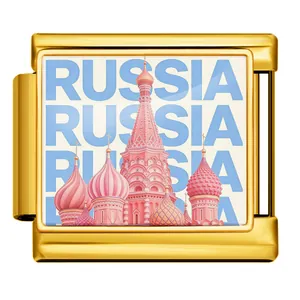 Detail view of gold-tone Italian charm link with pink Russia St. Basil's Cathedral design.