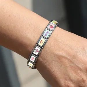 Detailed view of DIY stainless steel Italian charm bracelet with cute colorful icons
