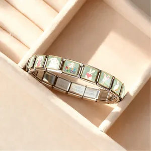 Detail of stainless steel Italian charm bracelet with Easter rabbit patterns