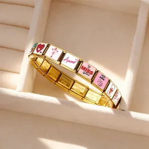 Detailed view of gold stainless steel Italian charm bracelet with heart and MISS YOU charms