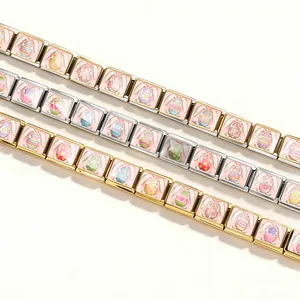 Detail of Easter egg and bunny patterns on DIY modular stainless steel charm bracelets.
