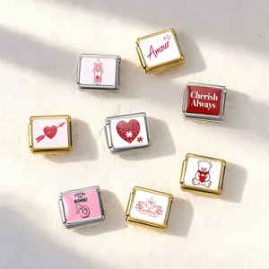 Detail view of Valentine's themed stainless steel modular charms with heart motifs.