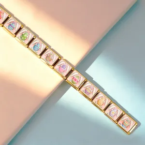 Detail view of gold Italian charm bracelet with colorful Easter egg and bunny designs