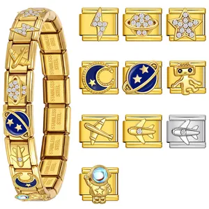 Detail view of gold Italian modular bracelet charms with space and celestial motifs