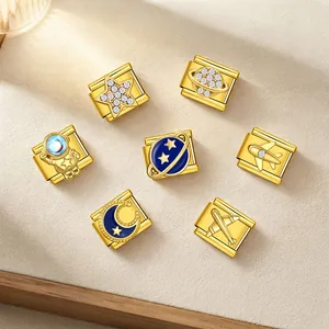 Close-up detail of Space series gold Italian charms featuring astronaut, moon and star motifs
