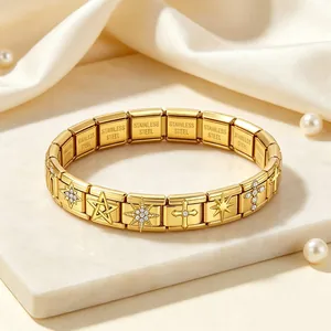 Detailed view of gold stainless steel Italian modular bracelet with star and cross charms