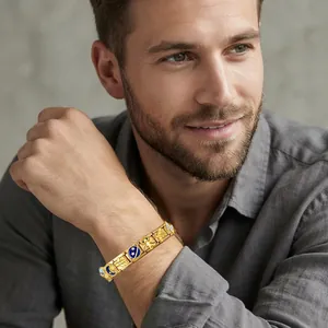 Detail shot of the space-themed Italian modular gold charm bracelet on a male model's wrist