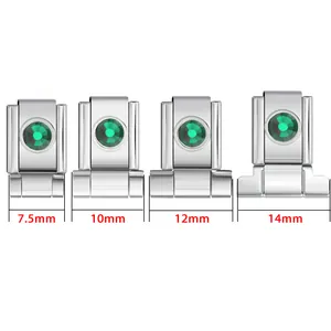 Detail view of stainless steel watch band connectors with green zircons in four sizes.