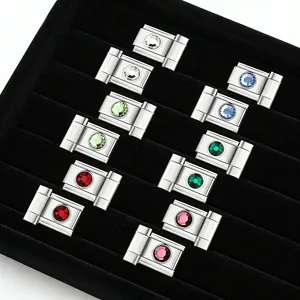 Detailed view of silver stainless steel Italian modular links with colorful zircons