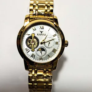 Detailed view of luxury gold automatic mechanical watch for men with sun moon dial