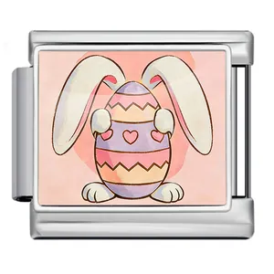 Close-up of a stainless steel Italian modular charm with a cute Easter bunny and egg design.