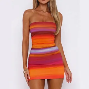 Close-up of vibrant rainbow striped strapless bodycon dress with ruching detail