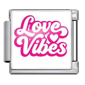 Detail view of a stainless steel Italian charm link featuring pink Love Vibes text and heart