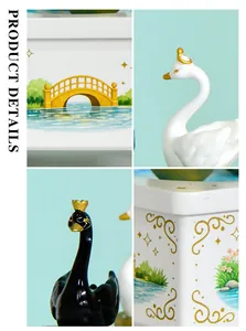 Detalle de la caja de música de cisne con puente y flores pintados a mano