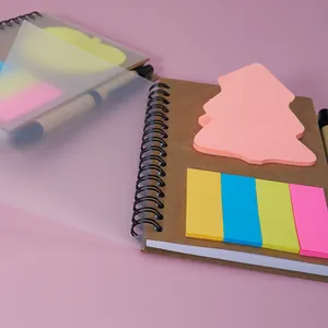 Detailed view of a mini A6 spiral notebook featuring colorful sticky notes and frosted cover