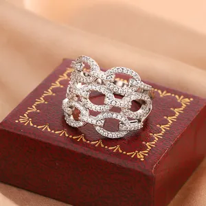Detailed view of luxury silver-toned chain-link ring encrusted with micro-pave stones.