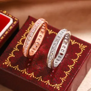 Detailed view of two elegant eternity rings with square-cut cubic zirconia stones.