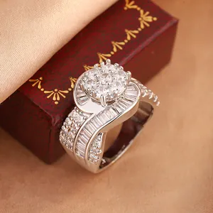 Close-up of luxury horseshoe ring featuring micro-pave cluster and baguette cut stones