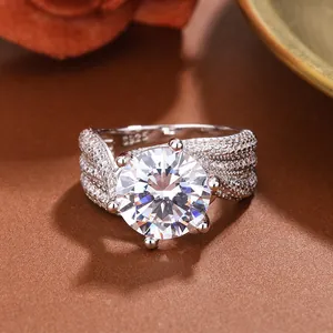 Close-up of sparkling 5-carat six-prong simulated diamond ring with pavé band