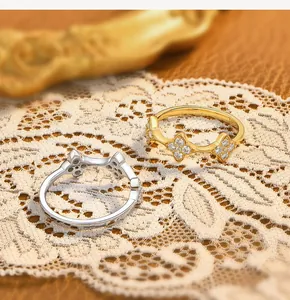 Close-up of S925 silver rings with elegant sparkling floral patterns and stones
