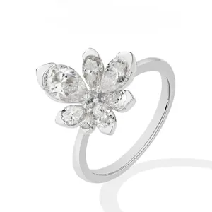 Detailed view of an elegant silver floral ring set with sparkling clear cubic zirconia stones.