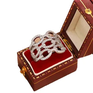 Luxury hollow pavé diamond wide band ring presented in a vintage red jewelry box