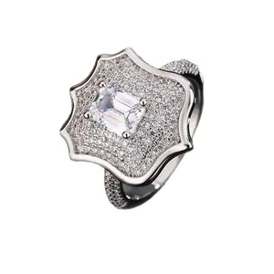 Luxury men's micro-paved zirconia shield ring with a large emerald-cut clear center stone