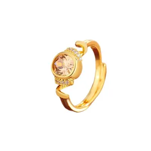 Elegant gold-plated adjustable ring featuring amber round crystal and micro-pave