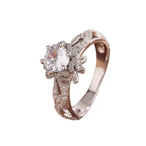 Rose gold hollow snowflake ring with a large round cubic zirconia stone