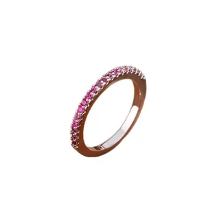 Elegant rose gold half eternity stacking ring with inlaid pink purple gemstones