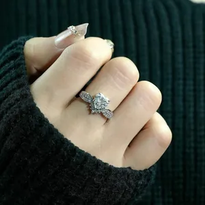 Macro shot of an exquisite heart-shaped crown ring with sparkling pavé stones on a finger
