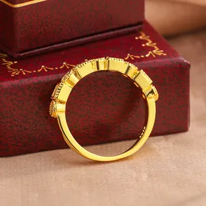 Close-up of vintage gold plated lace ring with delicate round stone detailing.